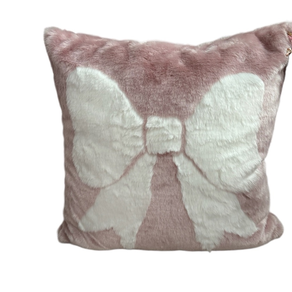 I have four of the same accent pillows, pink with a white bow